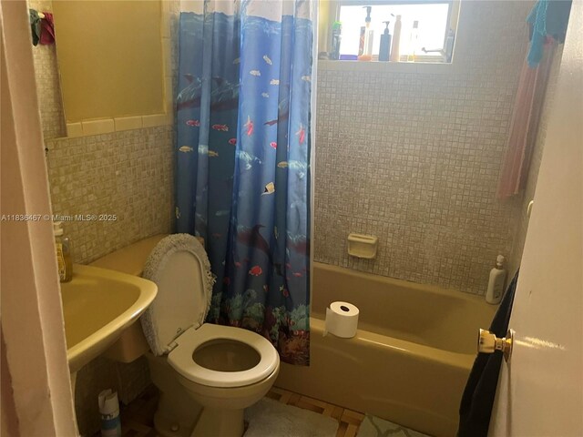 1825 NW 112th St, Miami, FL 33167 - full bath with shower / bath combination with curtain, tile walls, and a wainscoted wall