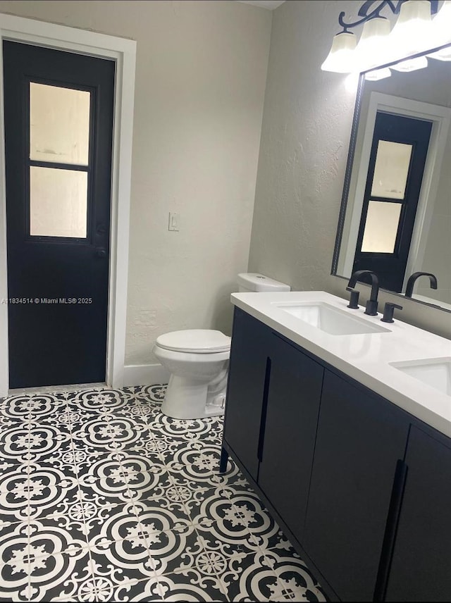 8924 47th Ct, Coral Springs, FL 33067 - bathroom with double vanity and a textured wall