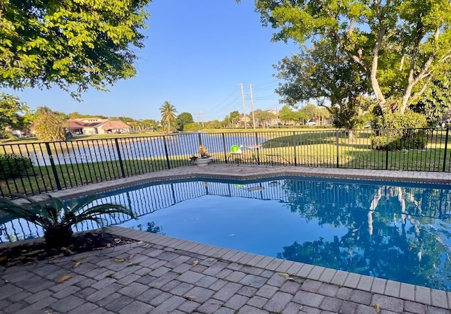 8924 47th Ct, Coral Springs, FL 33067 - view of swimming pool featuring a fenced backyard and a water view