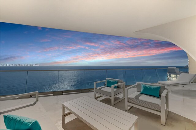 16901 Collins Ave Unit 2702, Sunny Isles Beach, FL 33160 - patio terrace at dusk with a water view and a balcony