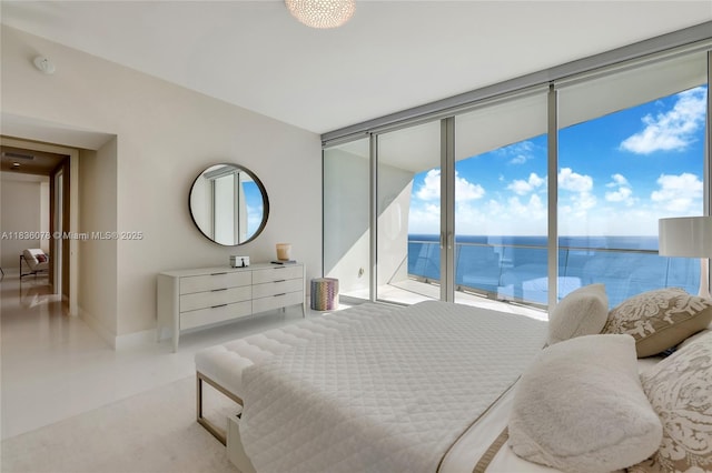 16901 Collins Ave Unit 2702, Sunny Isles Beach, FL 33160 - bedroom with a wall of windows, a water view, and access to outside