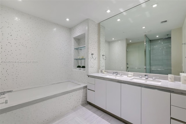 16901 Collins Ave Unit 2702, Sunny Isles Beach, FL 33160 - full bathroom featuring a stall shower, double vanity, and a garden tub