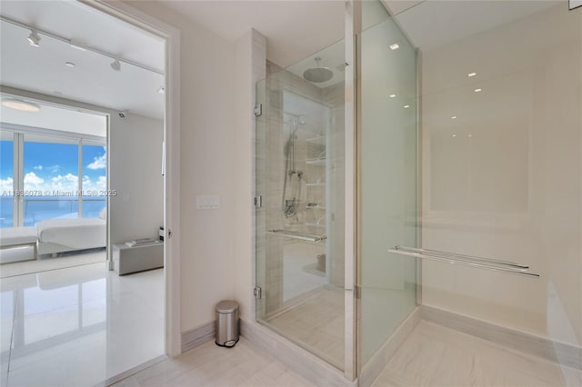 16901 Collins Ave Unit 2702, Sunny Isles Beach, FL 33160 - ensuite bathroom featuring a shower stall, rail lighting, and a water view