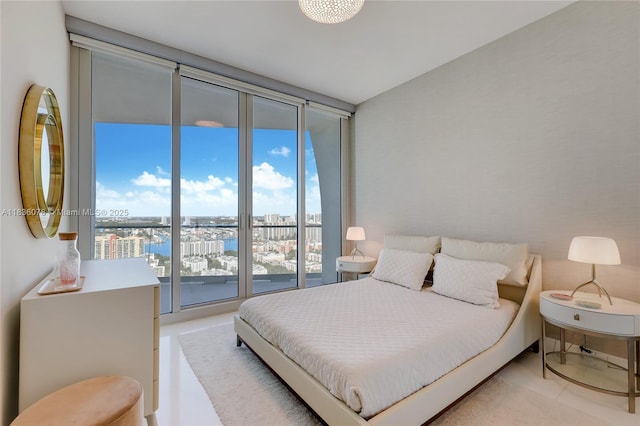 16901 Collins Ave Unit 2702, Sunny Isles Beach, FL 33160 - bedroom with a city view, tile patterned floors, and expansive windows