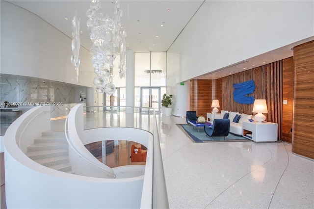 16901 Collins Ave Unit 2702, Sunny Isles Beach, FL 33160 - community lobby with wooden walls, a high ceiling, and expansive windows
