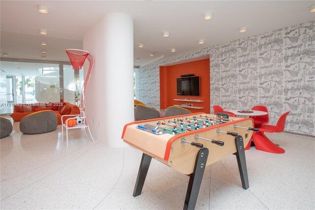 16901 Collins Ave Unit 2702, Sunny Isles Beach, FL 33160 - game room with wallpapered walls and speckled floor