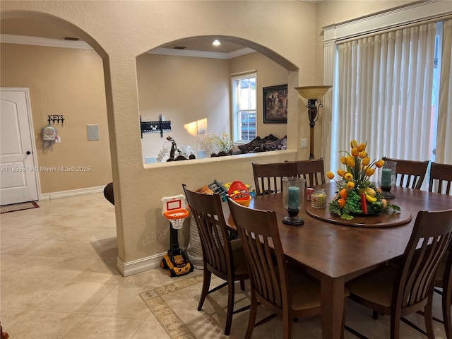 18122 NW 91st Ct, Hialeah, FL 33018 - dining area featuring crown molding, arched walkways, and light tile patterned floors
