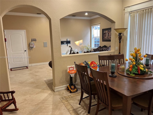 18122 NW 91st Ct, Hialeah, FL 33018 - dining room featuring arched walkways, ornamental molding, and light tile patterned floors