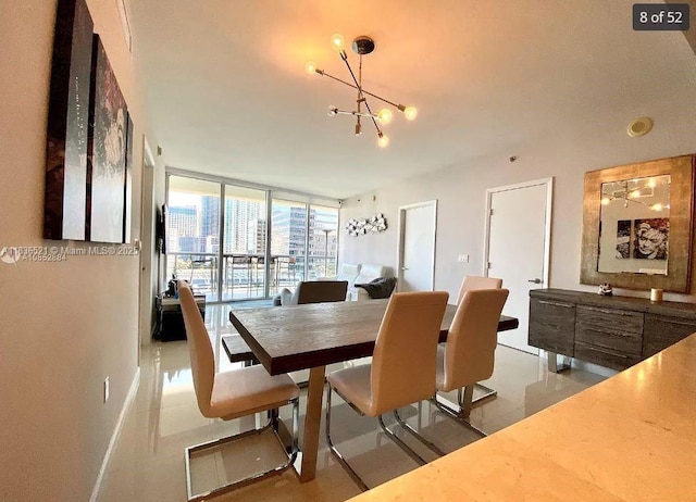 495 Brickell Ave Unit 1205, Miami, FL 33131 - dining room featuring floor to ceiling windows and a chandelier