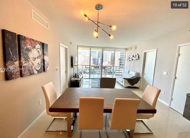 495 Brickell Ave Unit 1205, Miami, FL 33131 - dining space with floor to ceiling windows and a chandelier