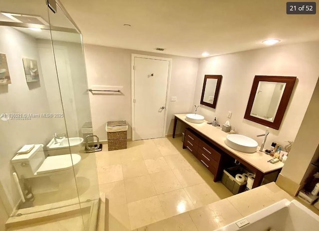 495 Brickell Ave Unit 1205, Miami, FL 33131 - bathroom featuring double vanity, a stall shower, recessed lighting, and tile patterned floors