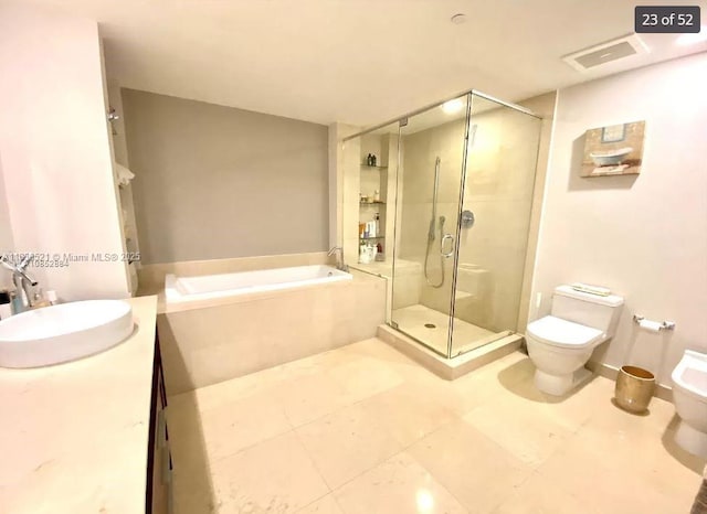 495 Brickell Ave Unit 1205, Miami, FL 33131 - bathroom featuring a shower stall, a garden tub, vanity, and a bidet