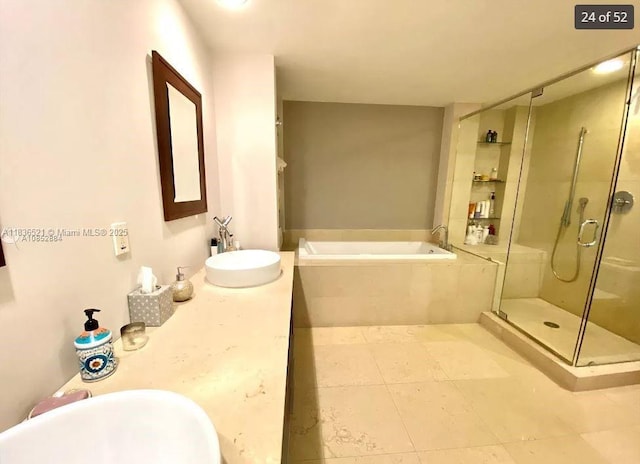 495 Brickell Ave Unit 1205, Miami, FL 33131 - full bath with a garden tub, a stall shower, vanity, and tile patterned floors