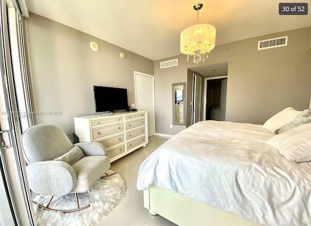 495 Brickell Ave Unit 1205, Miami, FL 33131 - bedroom featuring a chandelier and baseboards