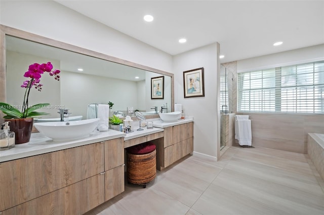 5194 NW 106th Ave, Doral, FL 33178 - full bath featuring two vanities, a stall shower, recessed lighting, and tile patterned floors