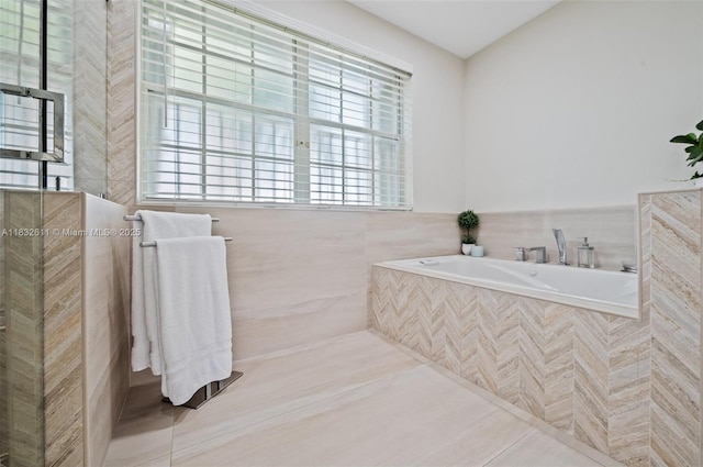 5194 NW 106th Ave, Doral, FL 33178 - bathroom with a bath and tile walls