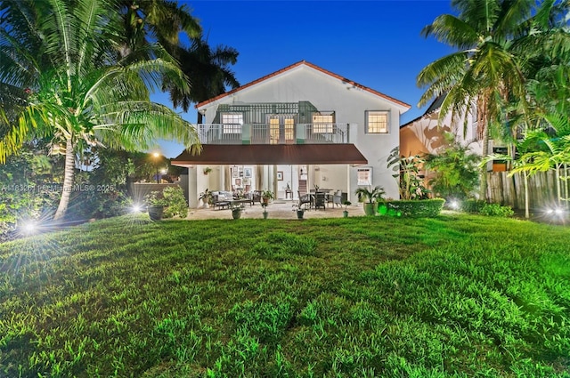 5194 NW 106th Ave, Doral, FL 33178 - rear view of house featuring a balcony, stucco siding, and a patio area