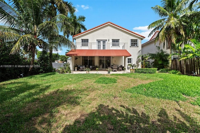 5194 NW 106th Ave, Doral, FL 33178 - rear view of property featuring a balcony, a patio area, stucco siding, and french doors