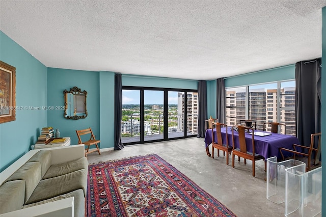 11111 Biscayne Blvd Unit 2100, Miami, FL 33181 - living area with concrete flooring, a textured ceiling, and a city view