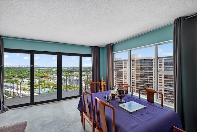 11111 Biscayne Blvd Unit 2100, Miami, FL 33181 - dining space with a textured ceiling, a city view, and concrete floors
