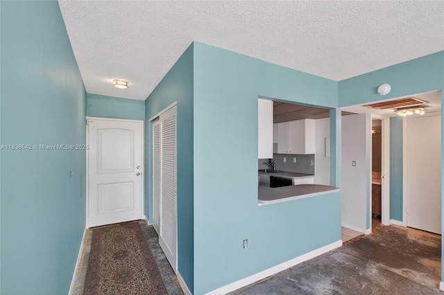 11111 Biscayne Blvd Unit 2100, Miami, FL 33181 - corridor featuring a textured ceiling and concrete flooring