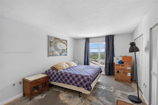 11111 Biscayne Blvd Unit 2100, Miami, FL 33181 - bedroom featuring concrete flooring and a textured ceiling
