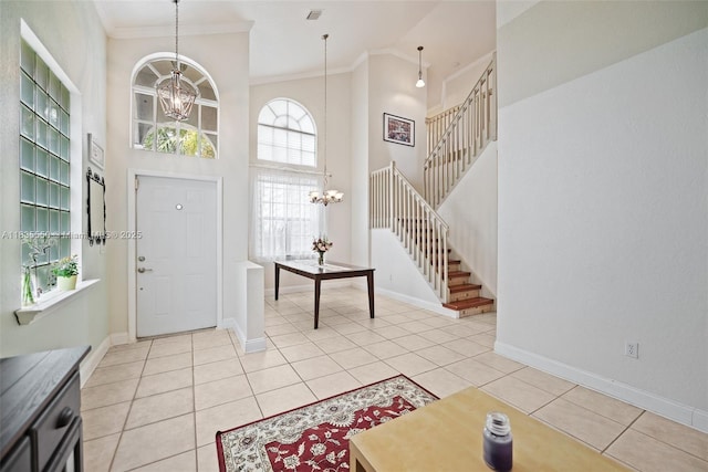 15376 NW 14th Mnr, Pembroke Pines, FL 33028 - foyer entrance featuring a chandelier, crown molding, stairway, a high ceiling, and light tile patterned floors