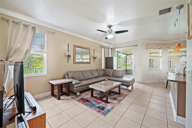 15376 NW 14th Mnr, Pembroke Pines, FL 33028 - living area featuring plenty of natural light, light tile patterned flooring, ceiling fan, crown molding, and a textured ceiling