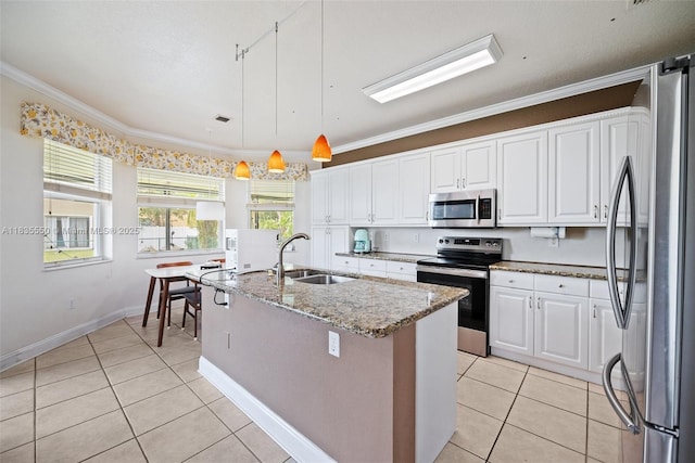 15376 NW 14th Mnr, Pembroke Pines, FL 33028 - kitchen with stainless steel appliances, light tile patterned floors, white cabinets, light stone counters, and a center island with sink