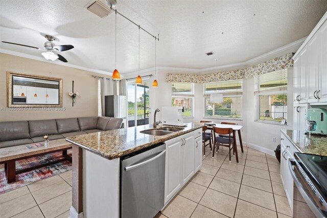 15376 NW 14th Mnr, Pembroke Pines, FL 33028 - kitchen featuring appliances with stainless steel finishes, crown molding, white cabinetry, light tile patterned flooring, and light stone counters