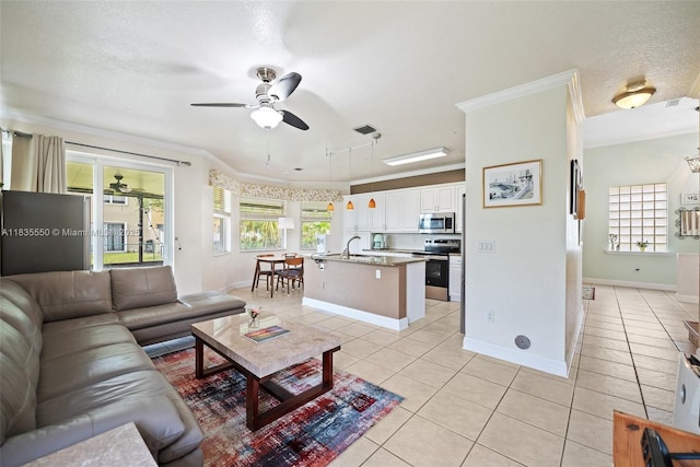 15376 NW 14th Mnr, Pembroke Pines, FL 33028 - living area featuring light tile patterned floors, a ceiling fan, crown molding, and a textured ceiling