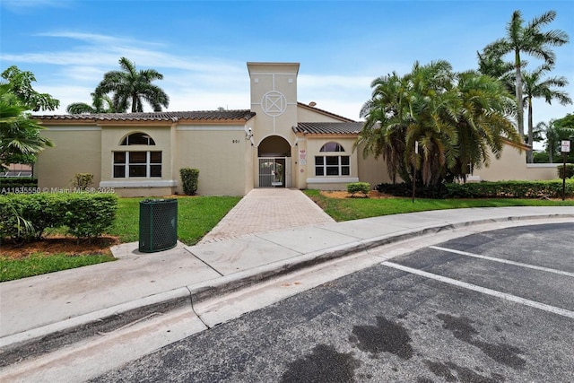 15376 NW 14th Mnr, Pembroke Pines, FL 33028 - view of front of home with stucco siding, uncovered parking, a front yard, and a tile roof