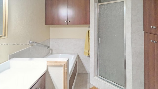841 NE 139th St, North Miami, FL 33161 - bathroom featuring a stall shower, a garden tub, and vanity