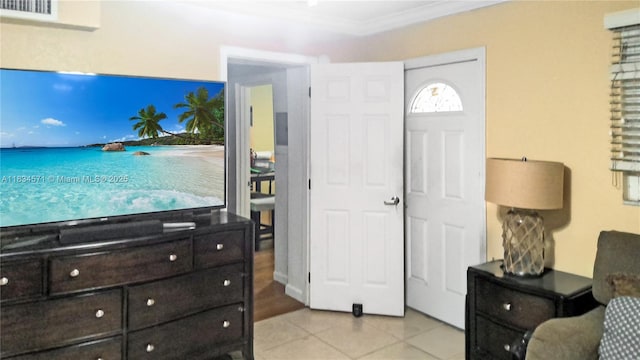 841 NE 139th St, North Miami, FL 33161 - entryway with light tile patterned floors and crown molding