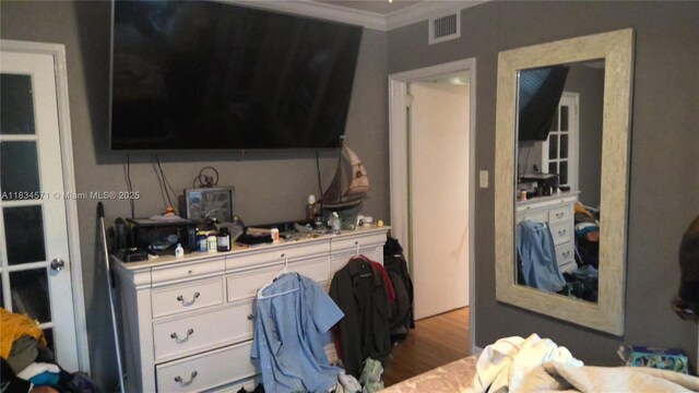841 NE 139th St, North Miami, FL 33161 - bedroom with crown molding and wood finished floors