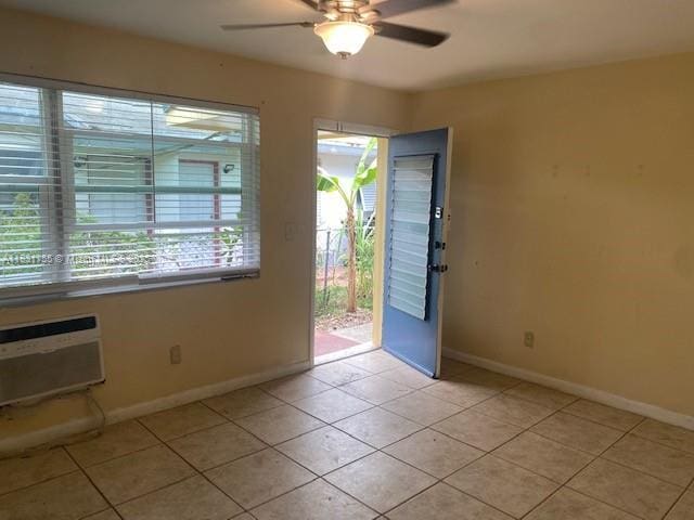 1990 NE 168th St, North Miami Beach, FL 33162 - entryway with ceiling fan, light tile patterned flooring, and a wall unit AC