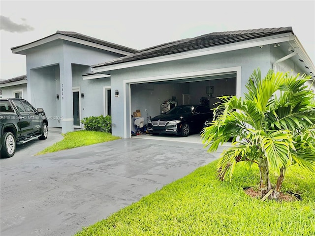 3838 NW 5th Ct, Lauderhill, FL 33311 - view of home's exterior with driveway, stucco siding, and a garage