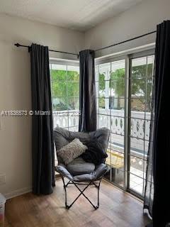 10441 Mahogany Key Cir Unit 202, Miami, FL 33196 - sitting room with baseboards