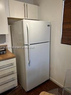 10441 Mahogany Key Cir Unit 202, Miami, FL 33196 - kitchen featuring freestanding refrigerator and white cabinets