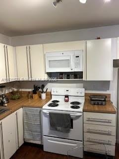 10441 Mahogany Key Cir Unit 202, Miami, FL 33196 - kitchen featuring white appliances, white cabinets, and dark wood-type flooring