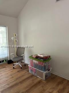 10441 Mahogany Key Cir Unit 202, Miami, FL 33196 - miscellaneous room with lofted ceiling and wood finished floors