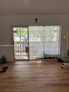 10441 Mahogany Key Cir Unit 202, Miami, FL 33196 - empty room with wood finished floors