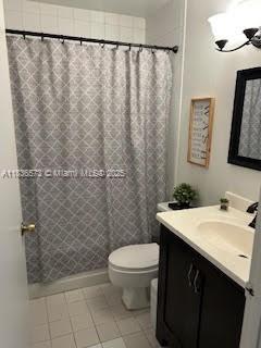 10441 Mahogany Key Cir Unit 202, Miami, FL 33196 - full bath with vanity, curtained shower, and tile patterned floors