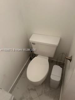10441 Mahogany Key Cir Unit 202, Miami, FL 33196 - bathroom featuring toilet and baseboards