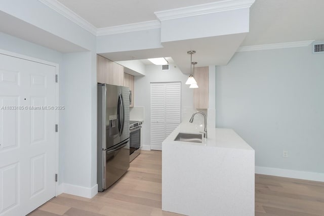 2000 N Bayshore Dr Unit 203, Miami, FL 33137 - kitchen with appliances with stainless steel finishes, crown molding, light wood finished floors, and light countertops