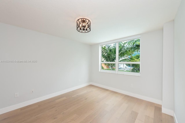 2000 N Bayshore Dr Unit 203, Miami, FL 33137 - spare room featuring light wood-type flooring and a chandelier