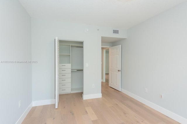 2000 N Bayshore Dr Unit 203, Miami, FL 33137 - unfurnished bedroom with light wood finished floors and a closet
