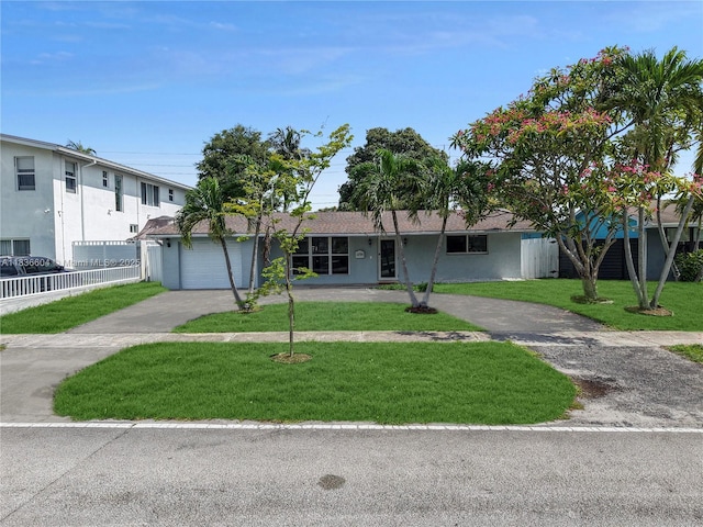 4721 W Park Rd, Hollywood, FL 33021 - ranch-style house with concrete driveway, stucco siding, and an attached garage