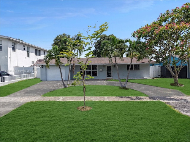 4721 W Park Rd, Hollywood, FL 33021 - ranch-style home with driveway, an attached garage, and stucco siding