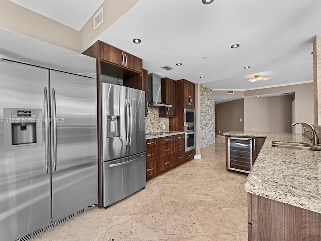 2645 S Bayshore Dr Unit 304, Miami, FL 33133 - kitchen with built in appliances, beverage cooler, wall chimney exhaust hood, backsplash, and dark brown cabinetry